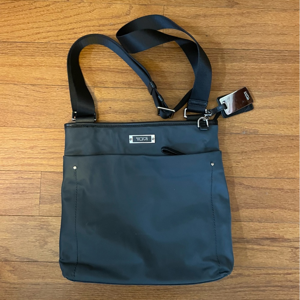 Tumi crossbody bag, grey synthetic material, gently used